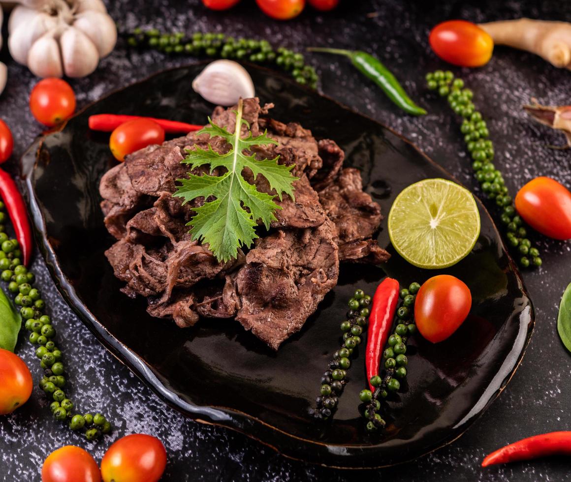 Pork with tomatoes, peppers, garlic and lime photo