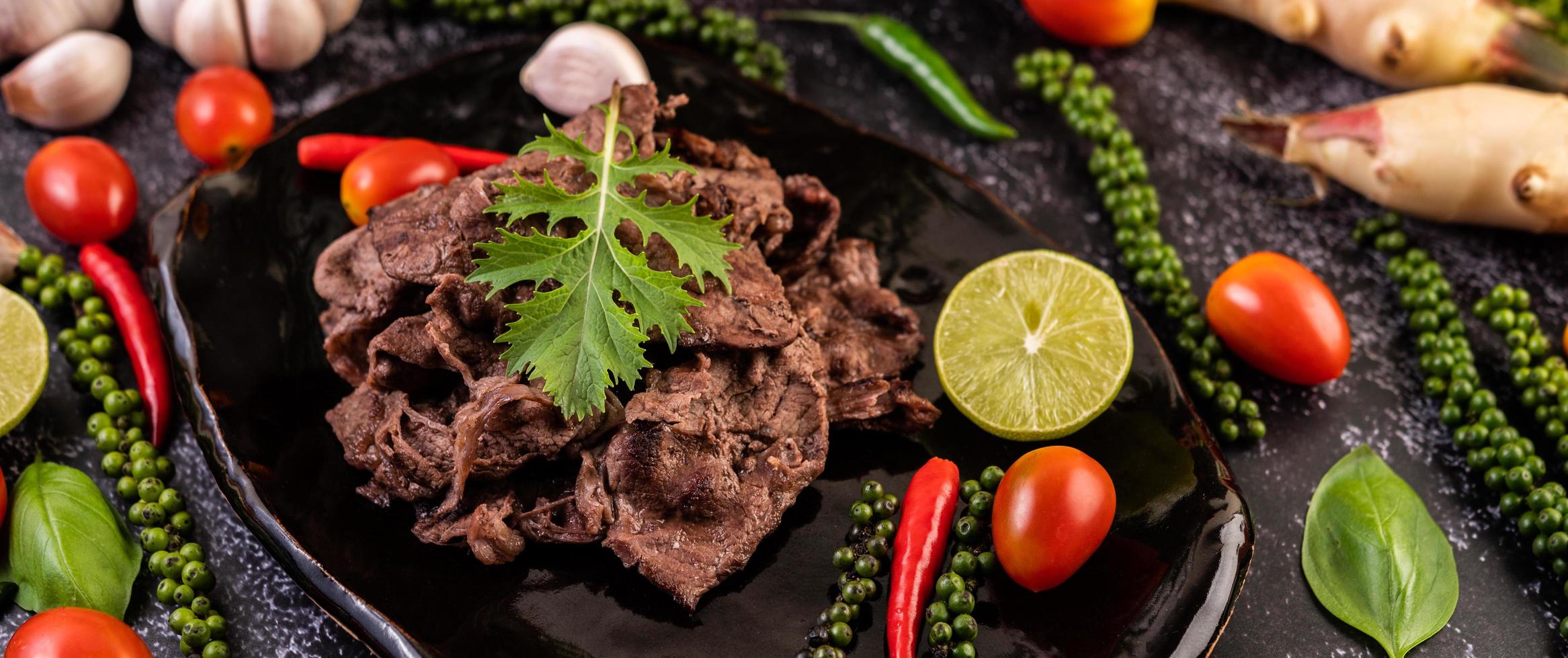 Pork with tomatoes, peppers, garlic and limee. photo