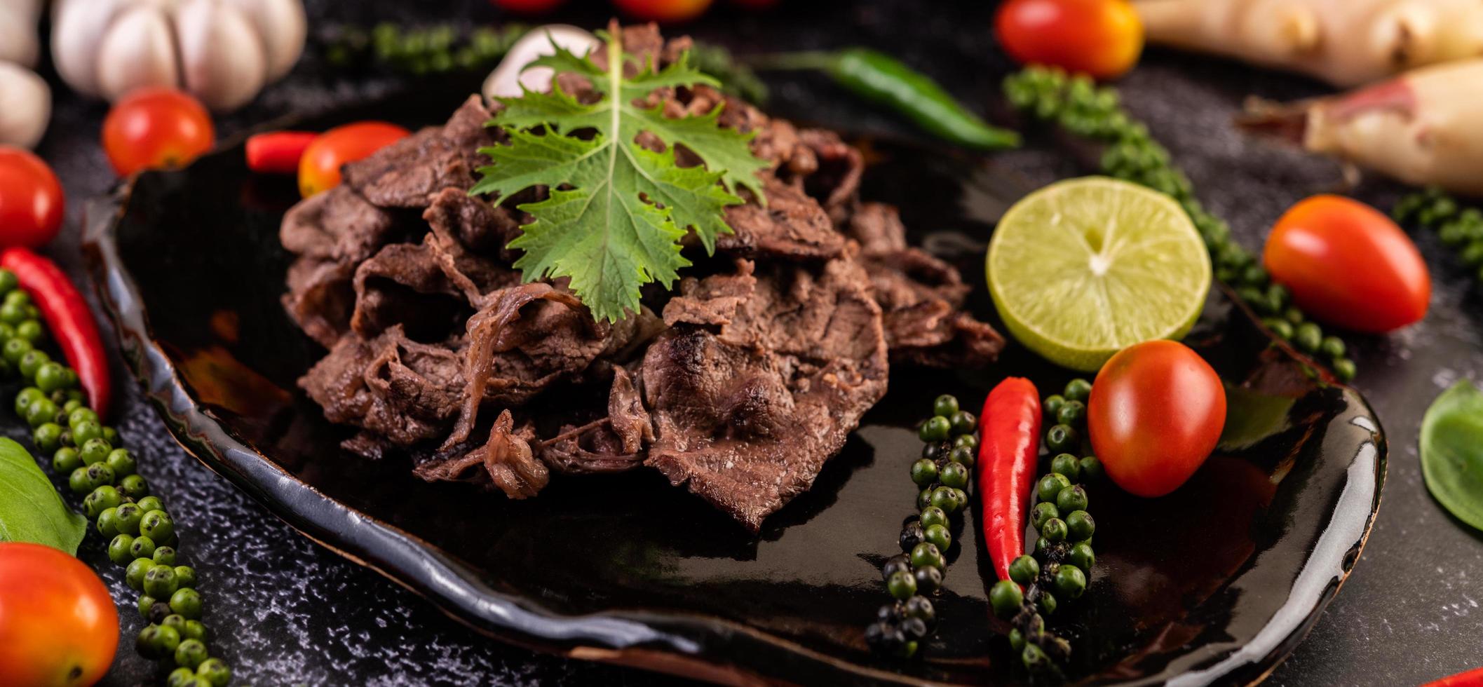 Pork with tomatoes, peppers, garlic and lime photo