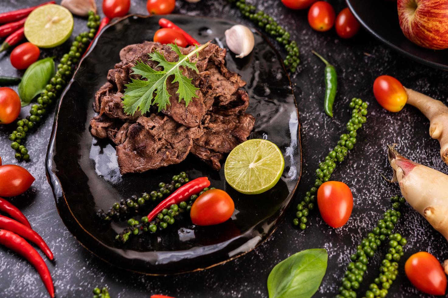 Pork with tomatoes, peppers, garlic and lime photo