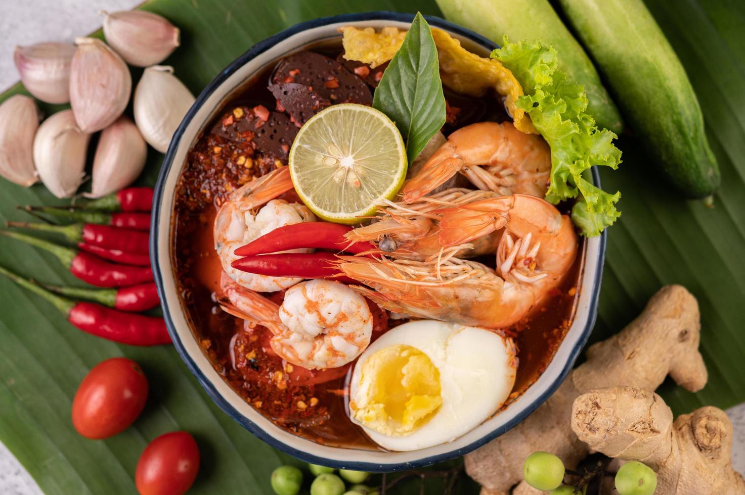 Tom yum noodles with shrimp and boiled eggs photo