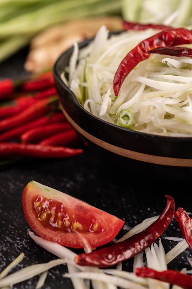 Papaya salad ingredients with fermented fish photo