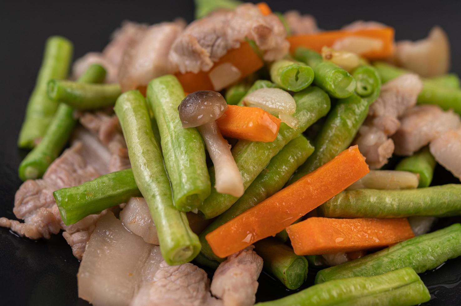 Stir-fried long beans and carrots with pork belly photo