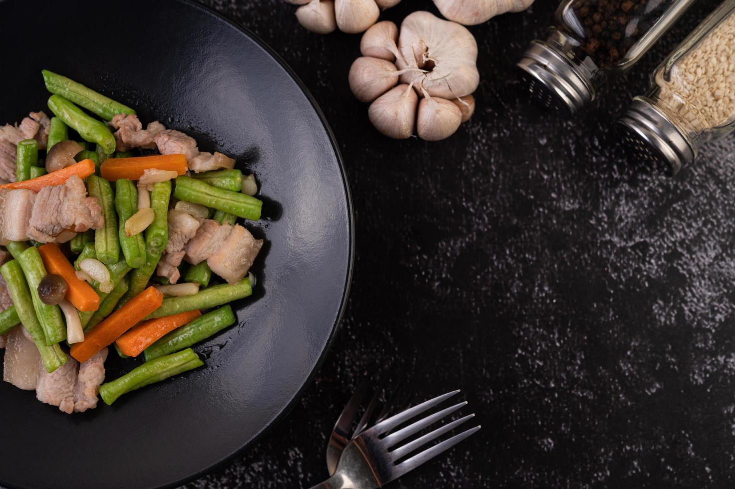 Stir-fried long beans and carrots with pork belly photo