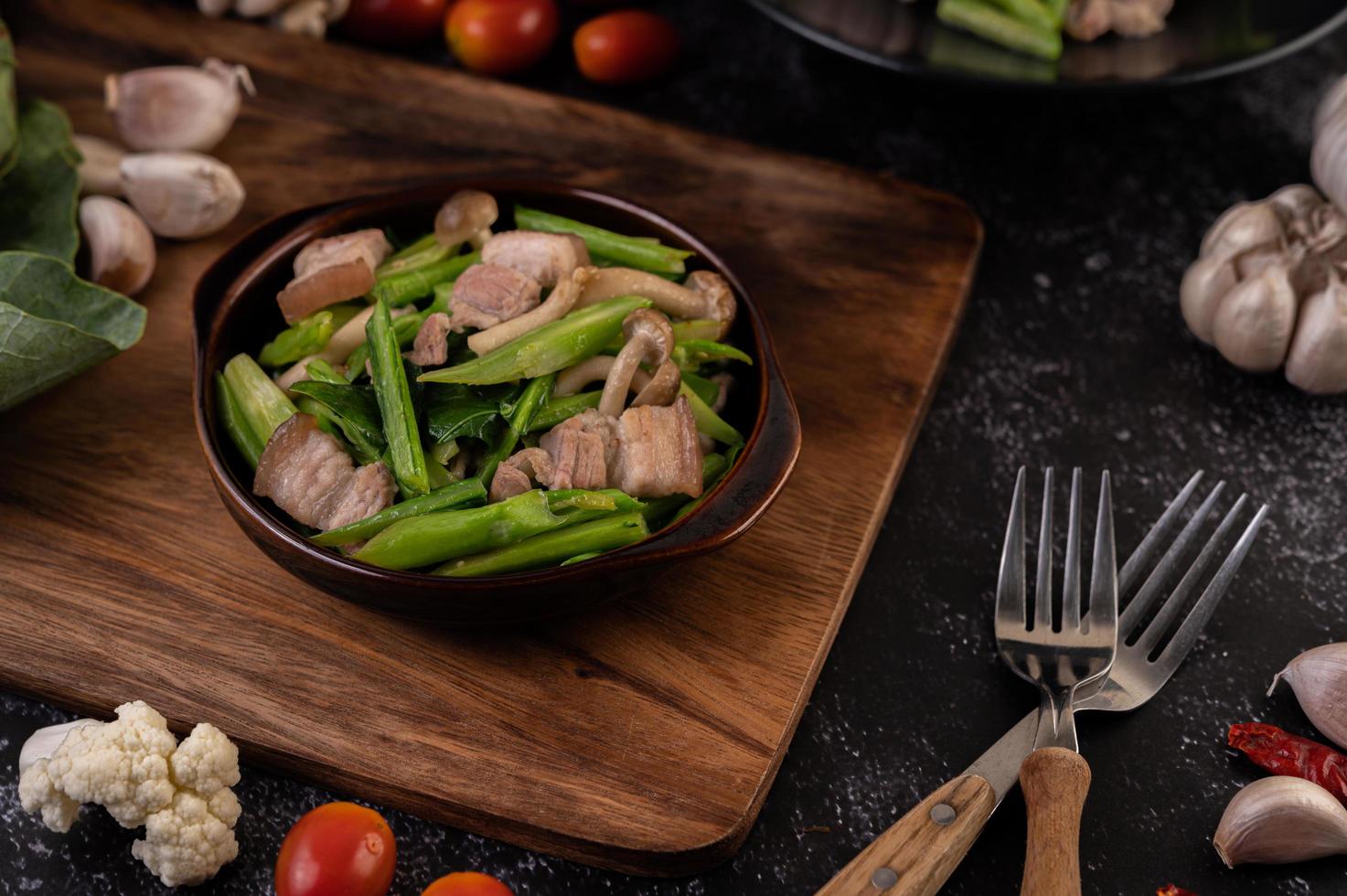 Stir-fried kale and pork belly photo