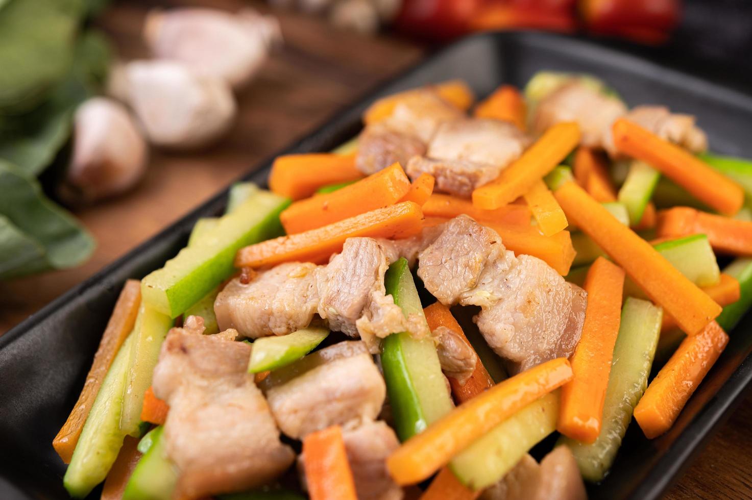 Stir fry vegetables with pork belly photo