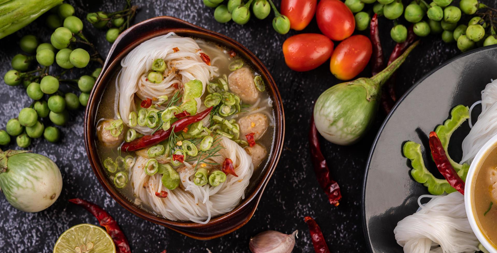 Rice noodles with chilies, melon, lentils and lemon photo