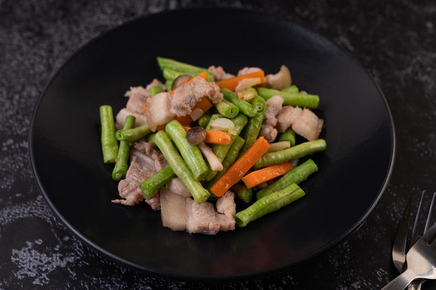 Stir-fried long beans and carrots with pork belly photo