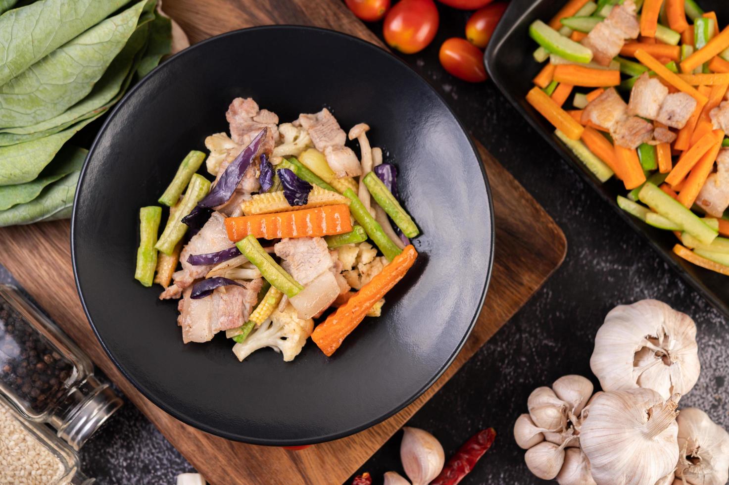 Stir fry vegetables with pork belly photo