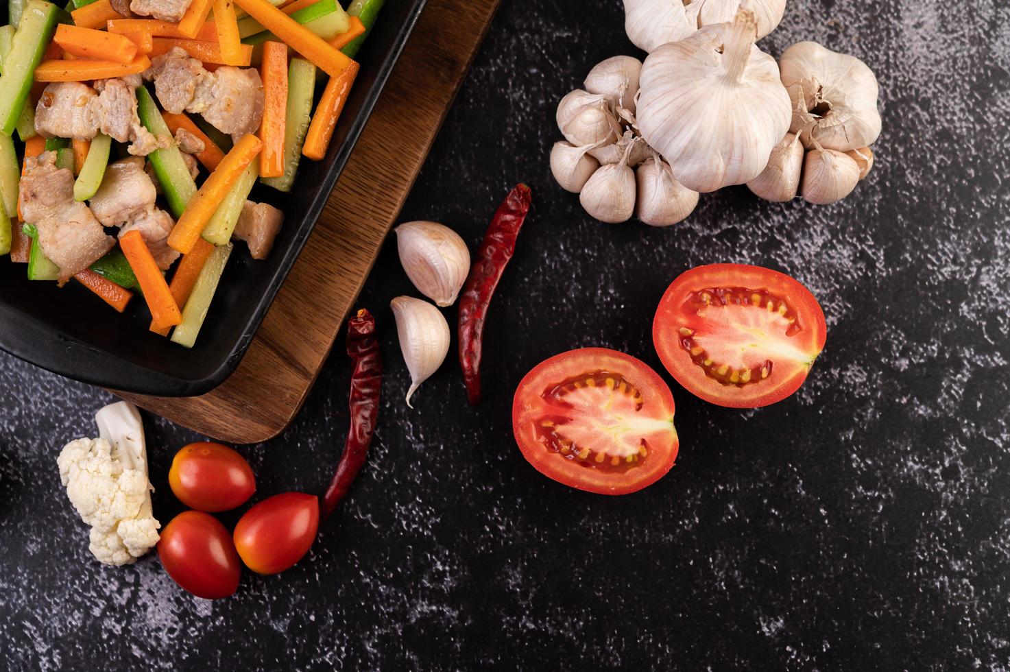 Stir fry vegetables with pork belly photo