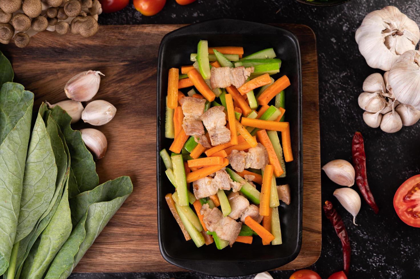 Stir fry vegetables with pork belly photo