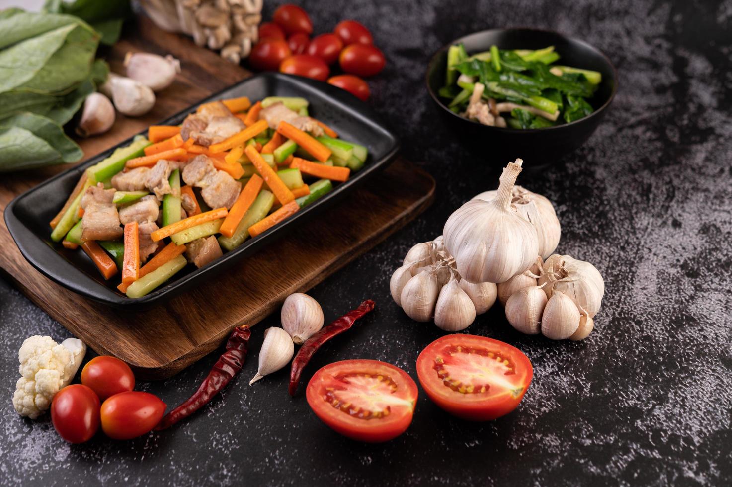 Stir fry vegetables with pork belly photo