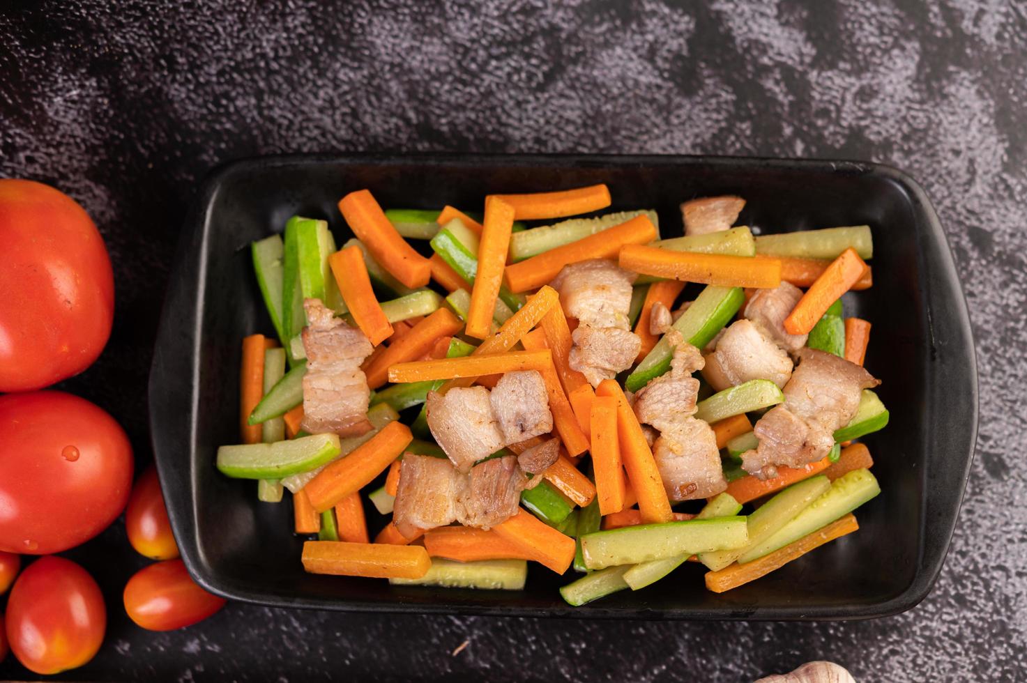 Stir fry vegetables with pork belly photo