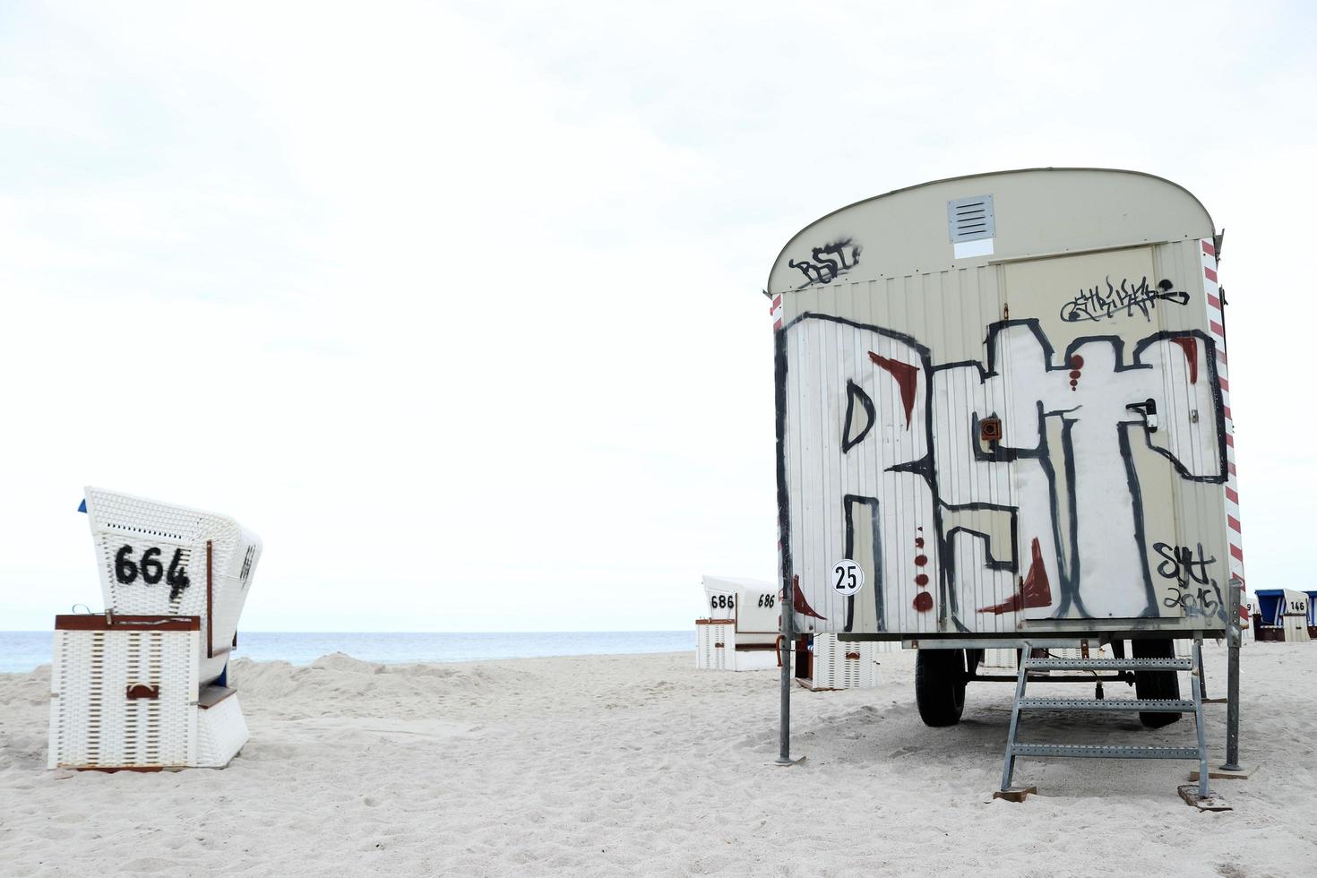 Painted van parked on the beach photo