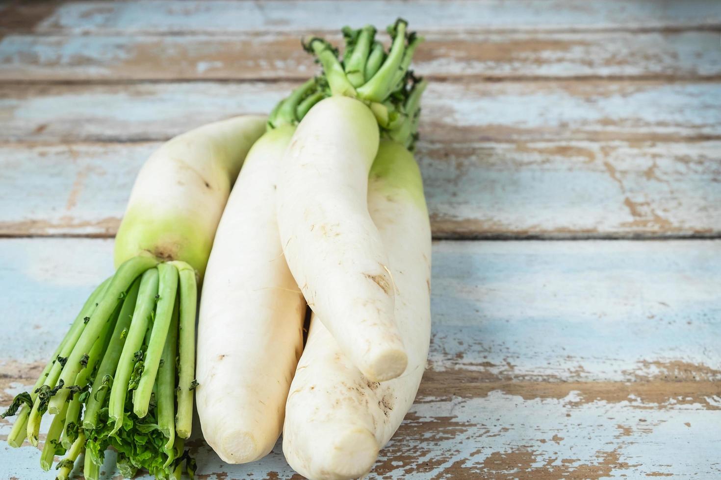 Radishes on a wooden background photo