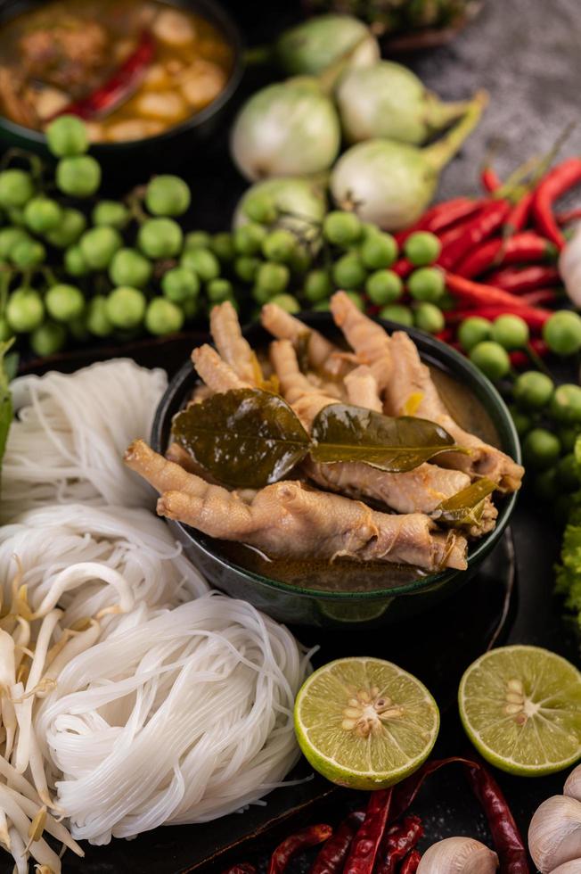 Rice noodles and chicken feet with chili photo