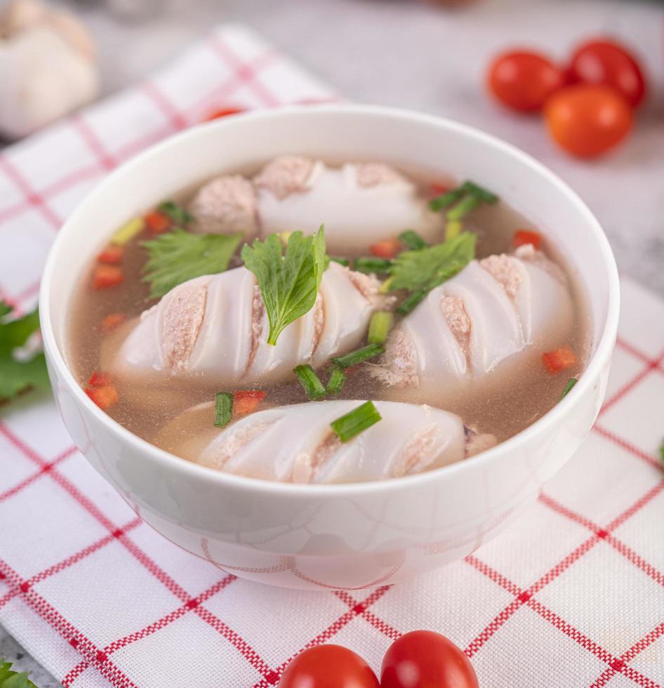 Pork-stuffed squid soup with tomatoes photo