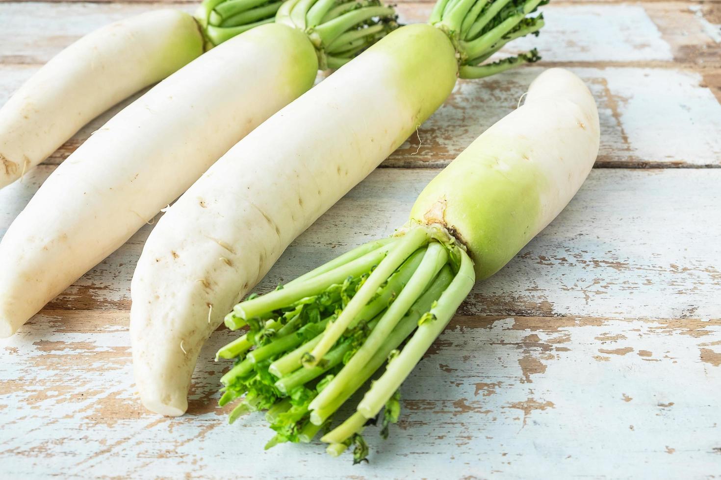 Close-up of radishes on a wooden background photo