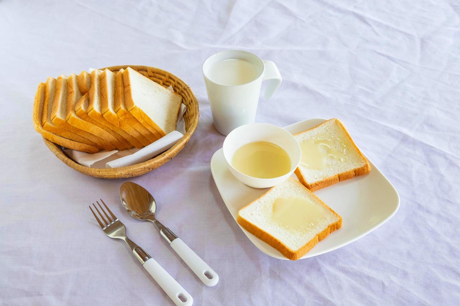 Toast and milk on a table photo