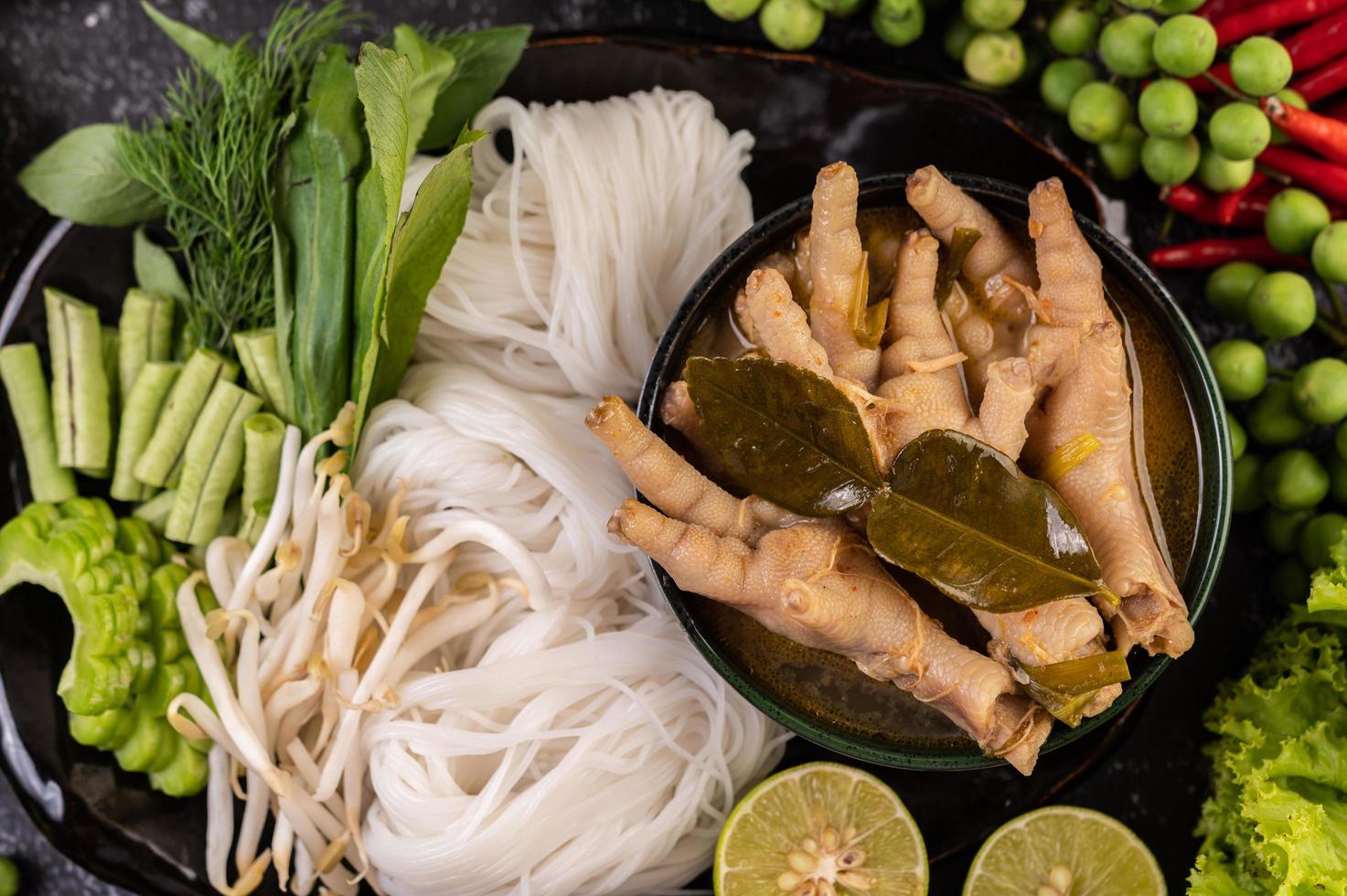 Rice noodles and chicken feet with sauce photo