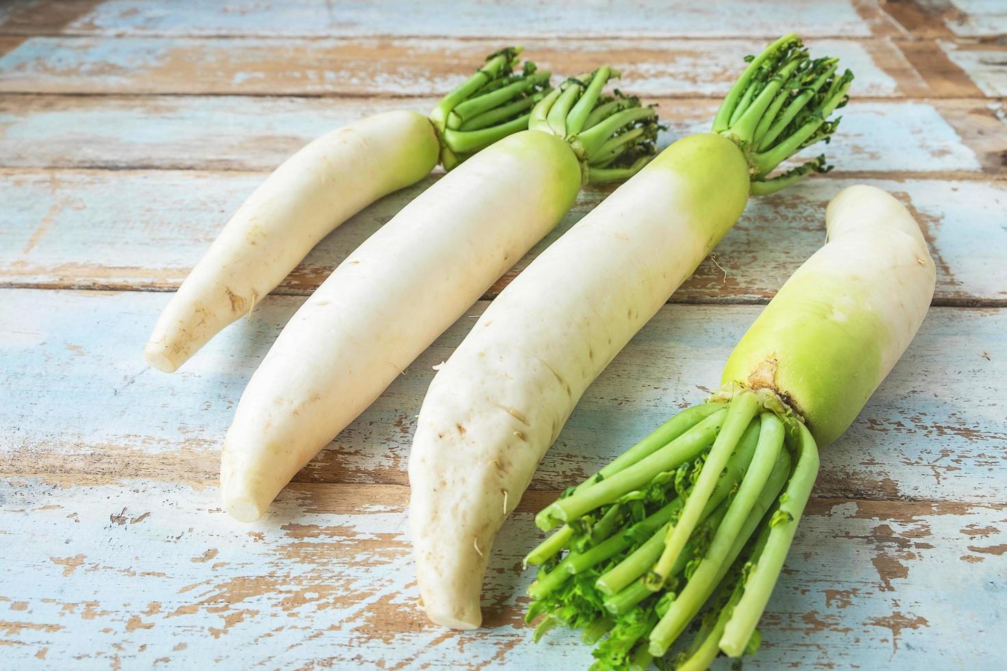 Radishes on a wooden table photo