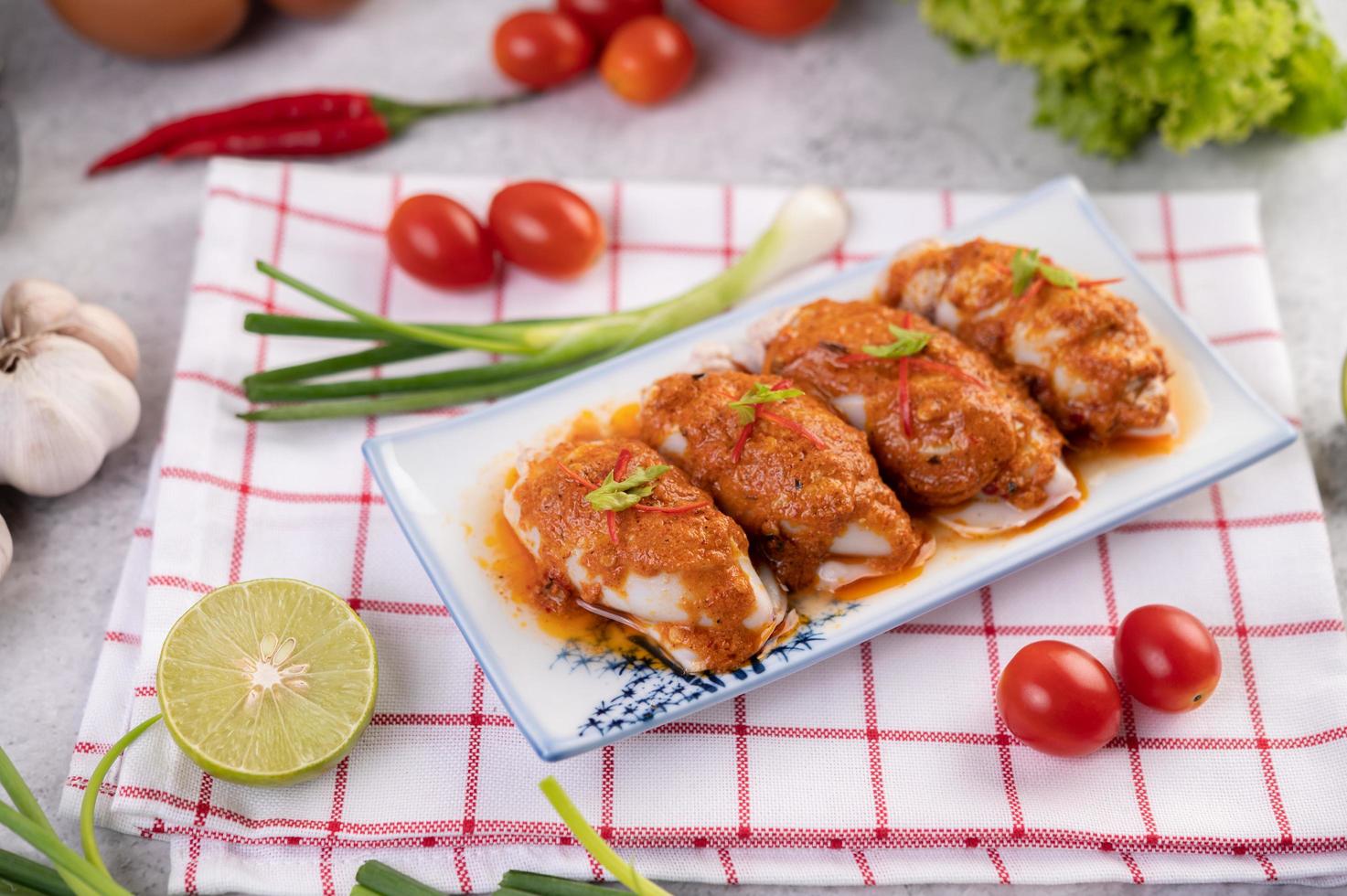 Chu che squid with spring onion, tomato, lemons and chili photo