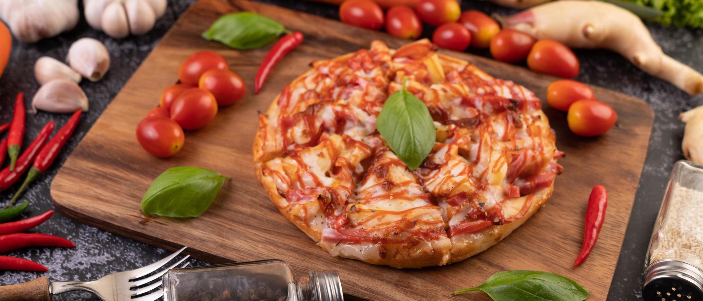 Chili and tomato pizza photo