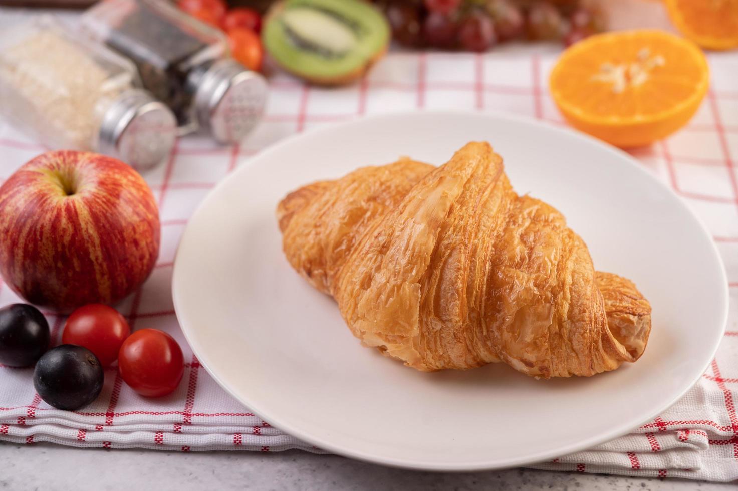 Croissant with fruits photo