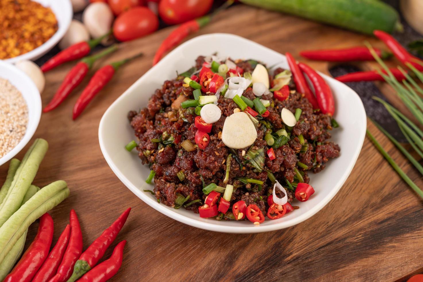 Spicy minced meat meal in a bowl photo