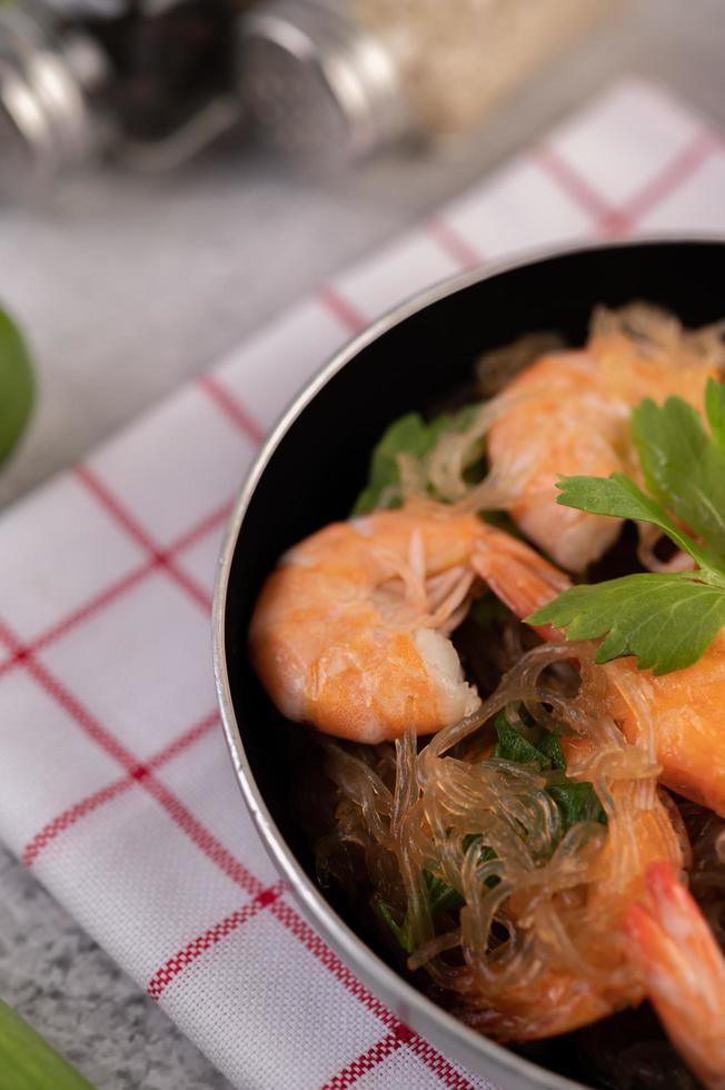 Baked shrimp in a pan close-up photo