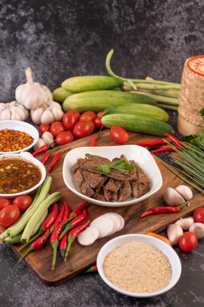 Grilled pork liver and ingredients on background photo