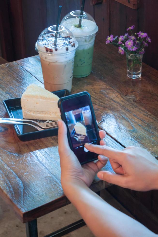 Person taking a picture of food photo