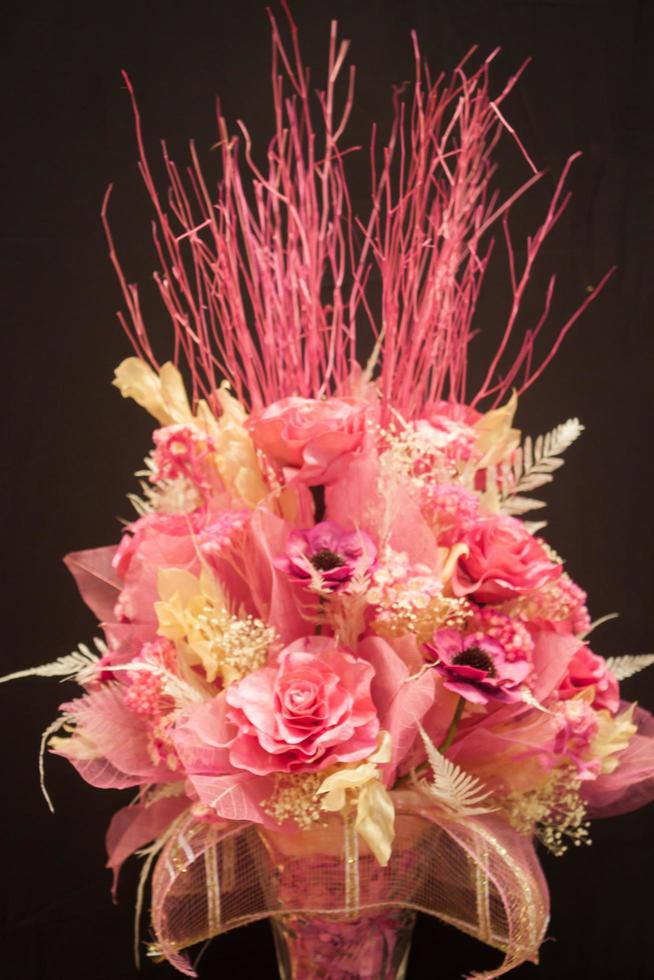 Pink floral bouquet on a black background photo