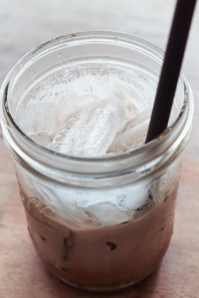 Close-up of an iced drink with a straw photo