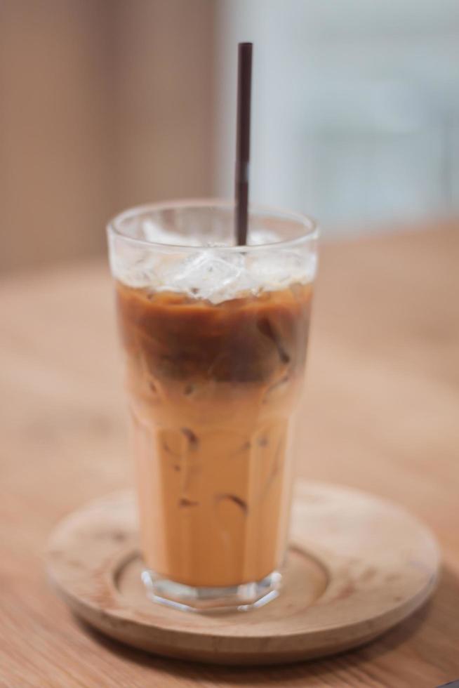 Iced coffee in a coffee shop on a wooden tray photo