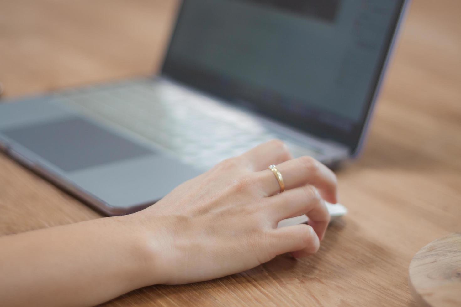 Hand on a mouse using a computer photo