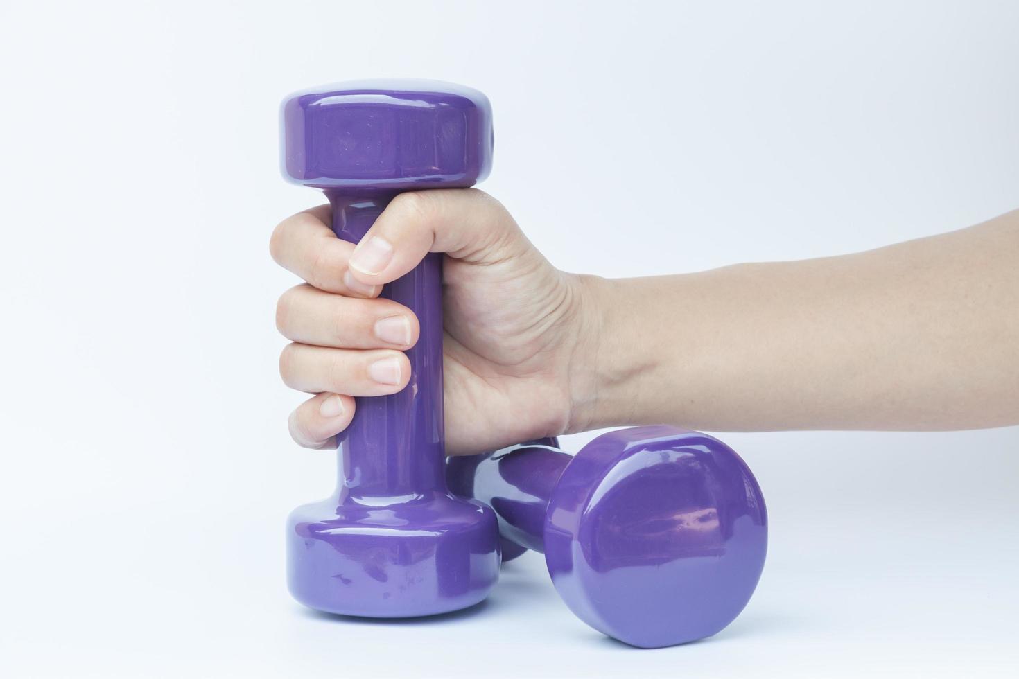 Two dumbbells with a hand photo