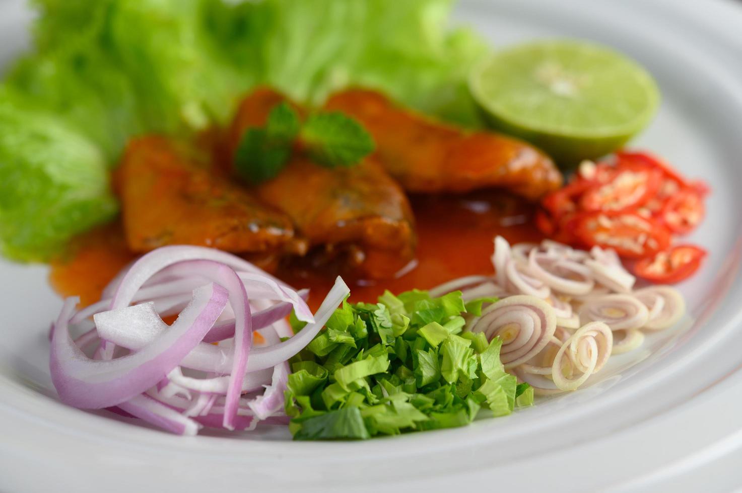 Sardines with tomato sauce and herbs photo