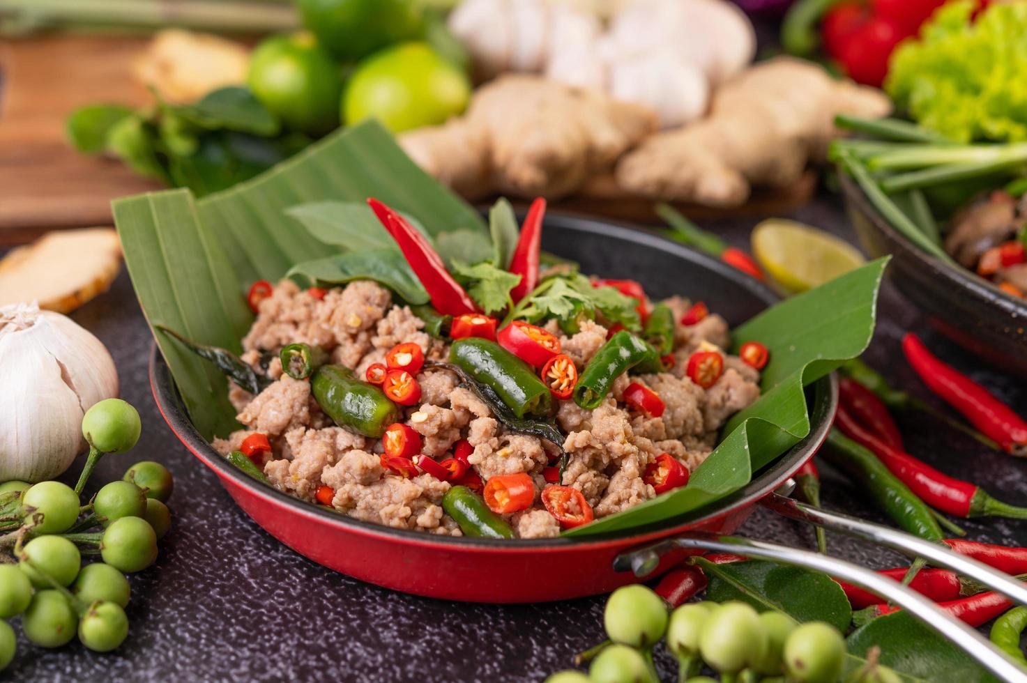 Stir-fried pork basil on banana leaves photo