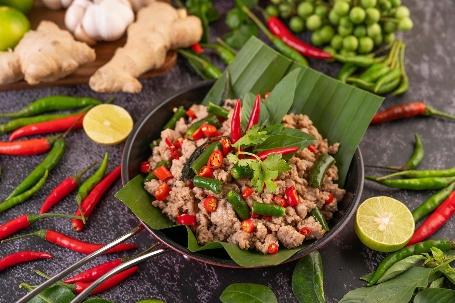 Stir-fried pork basil on banana leaves photo