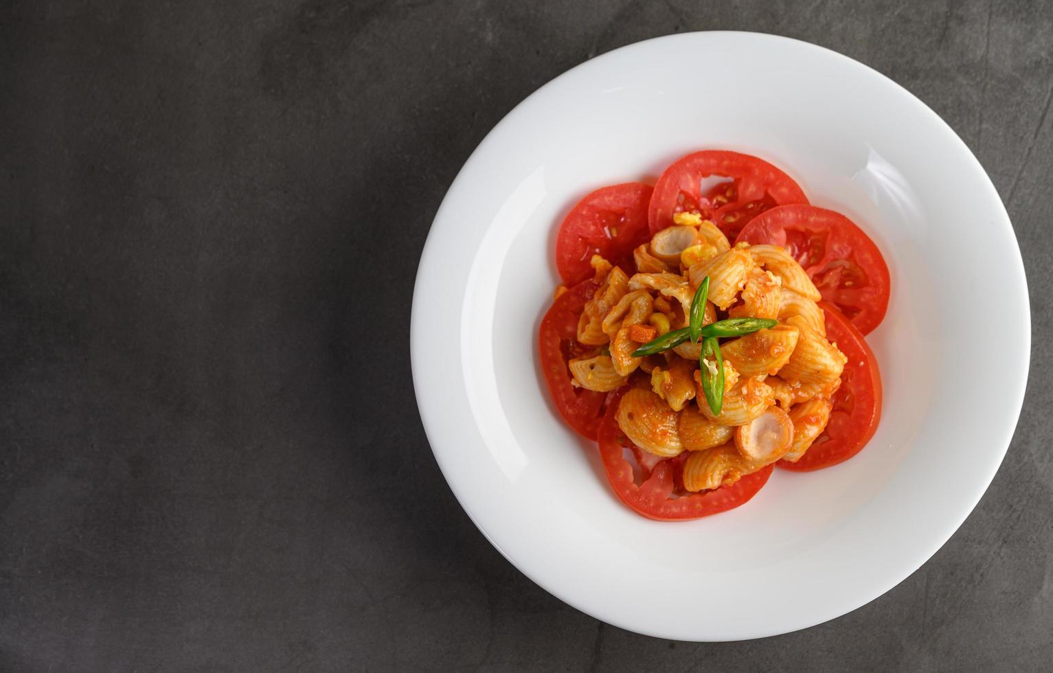 Stir fried macaroni with tomatoes photo