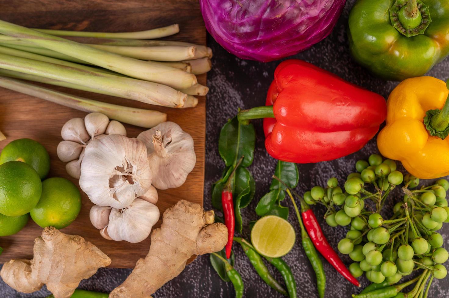 Chili, lime, basil, kaffir lime leaves, eggplant, ginger and spring onions photo