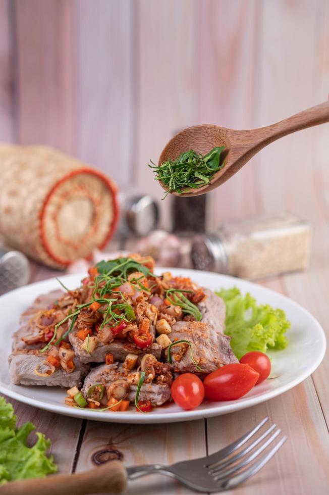 Spicy pork minced with tomatoes photo