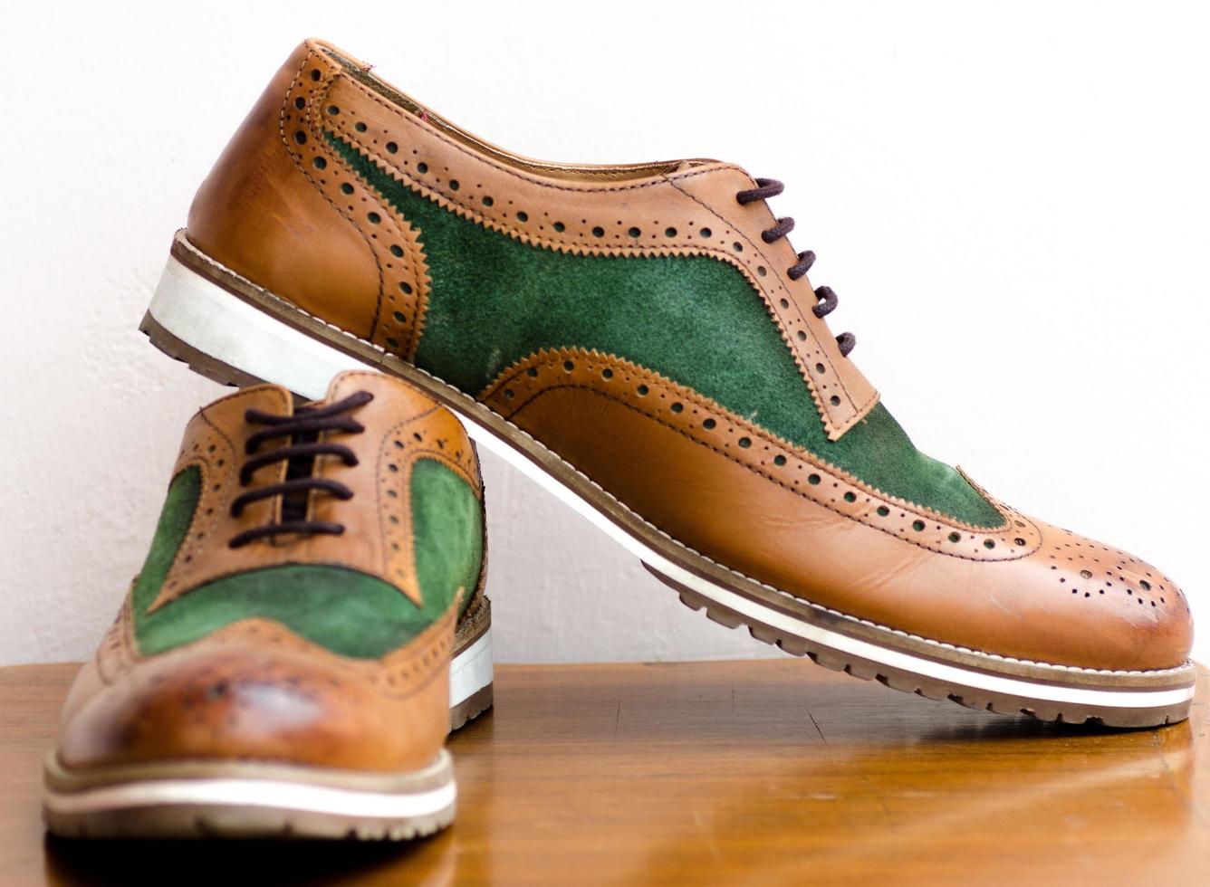 Close-up of brown and green shoes photo