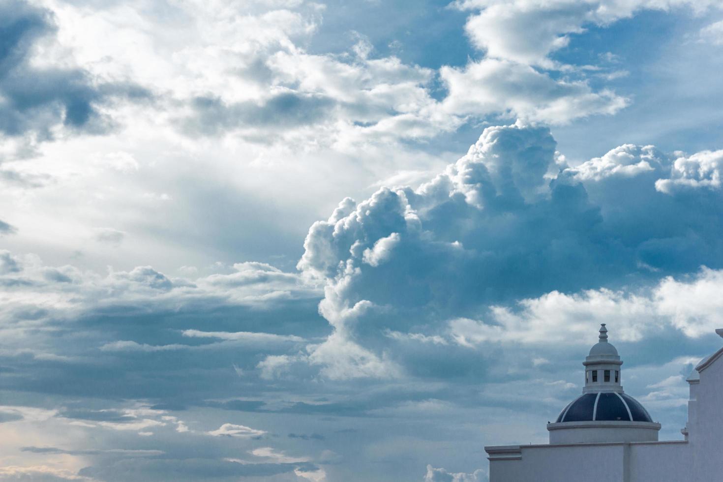 White tower under a cloudy sky photo