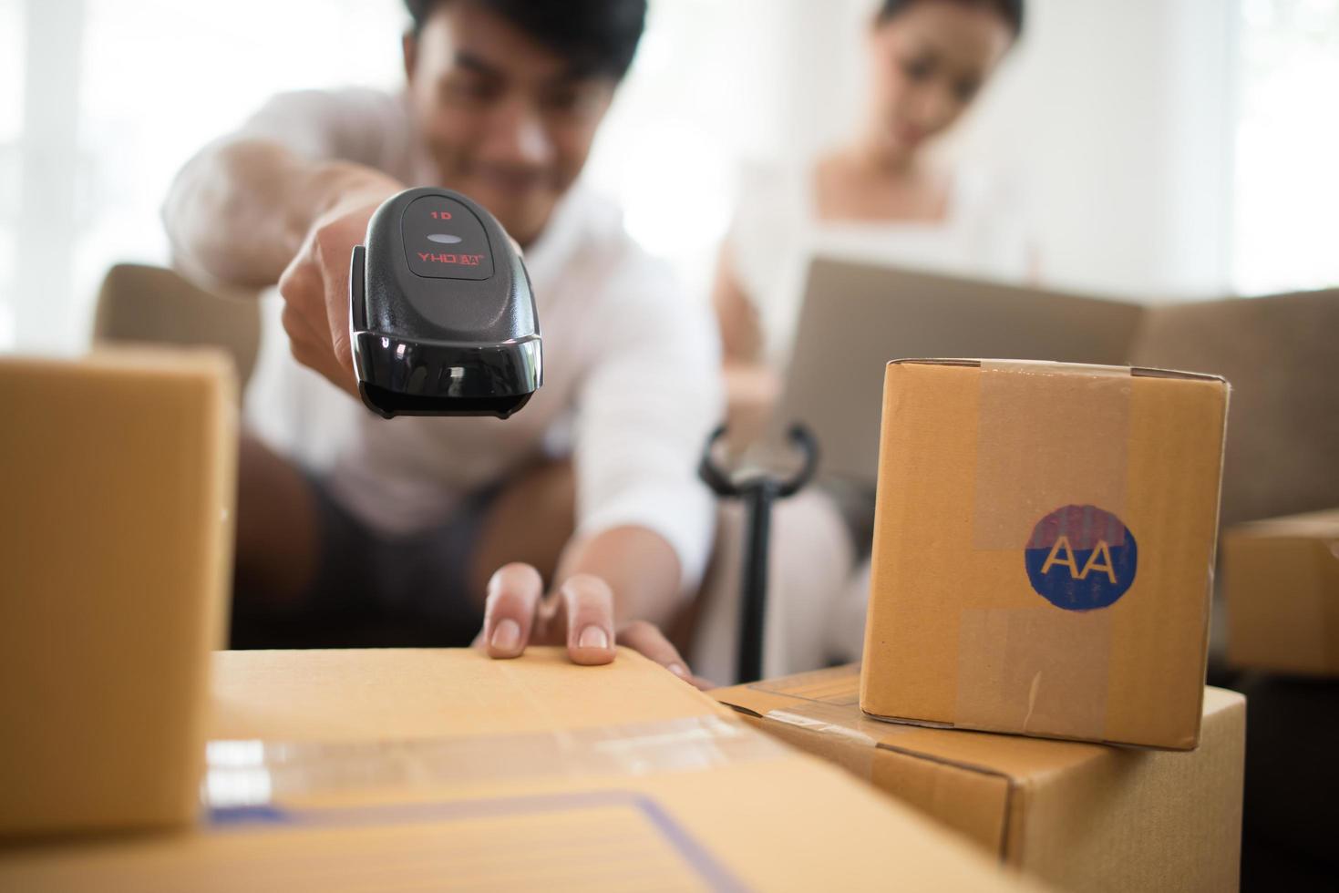 Happy couple at home office with online business photo