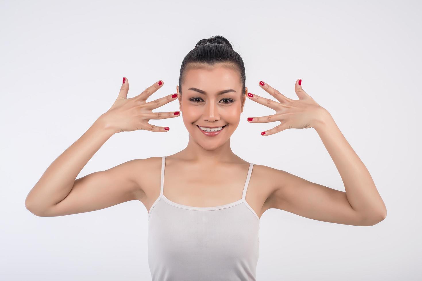 A woman poses for camera with a smile photo