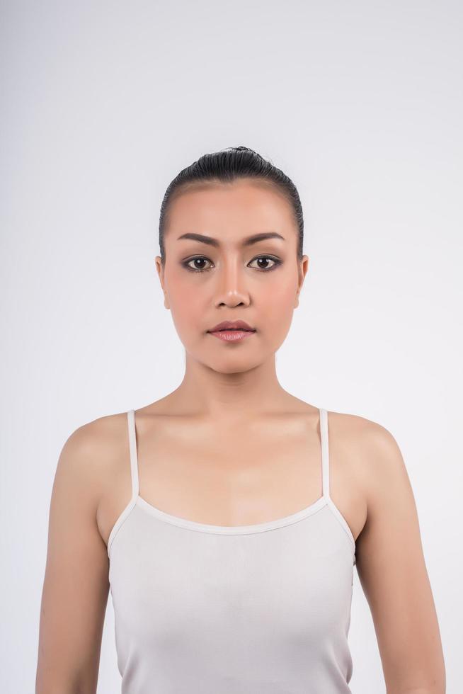 Young woman portrait on neutral background photo