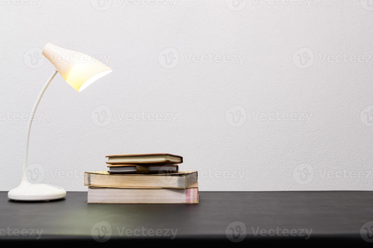 A stack of books on a table photo