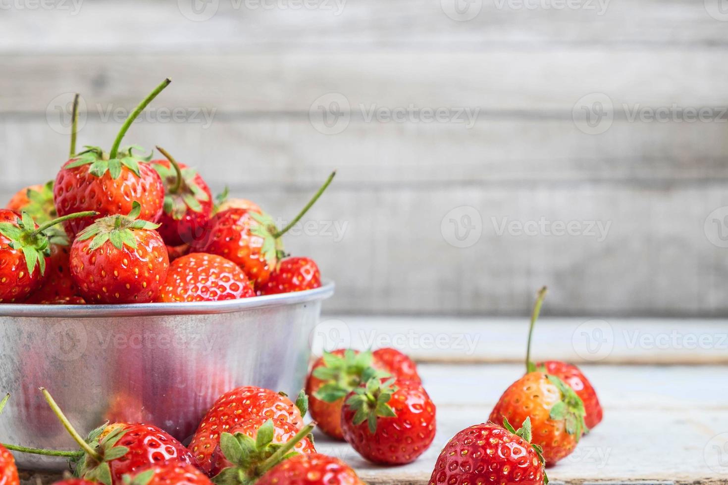 Metal bowl of strawberries photo